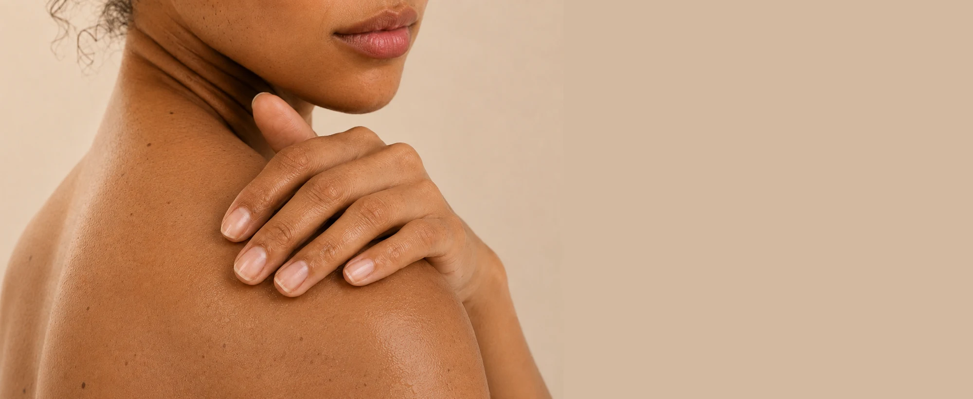 A hand resting gently on bare skin